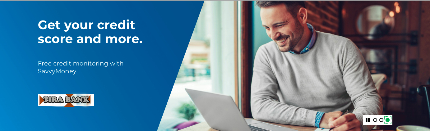 Group of people smiling while they hold hands in the meadow.